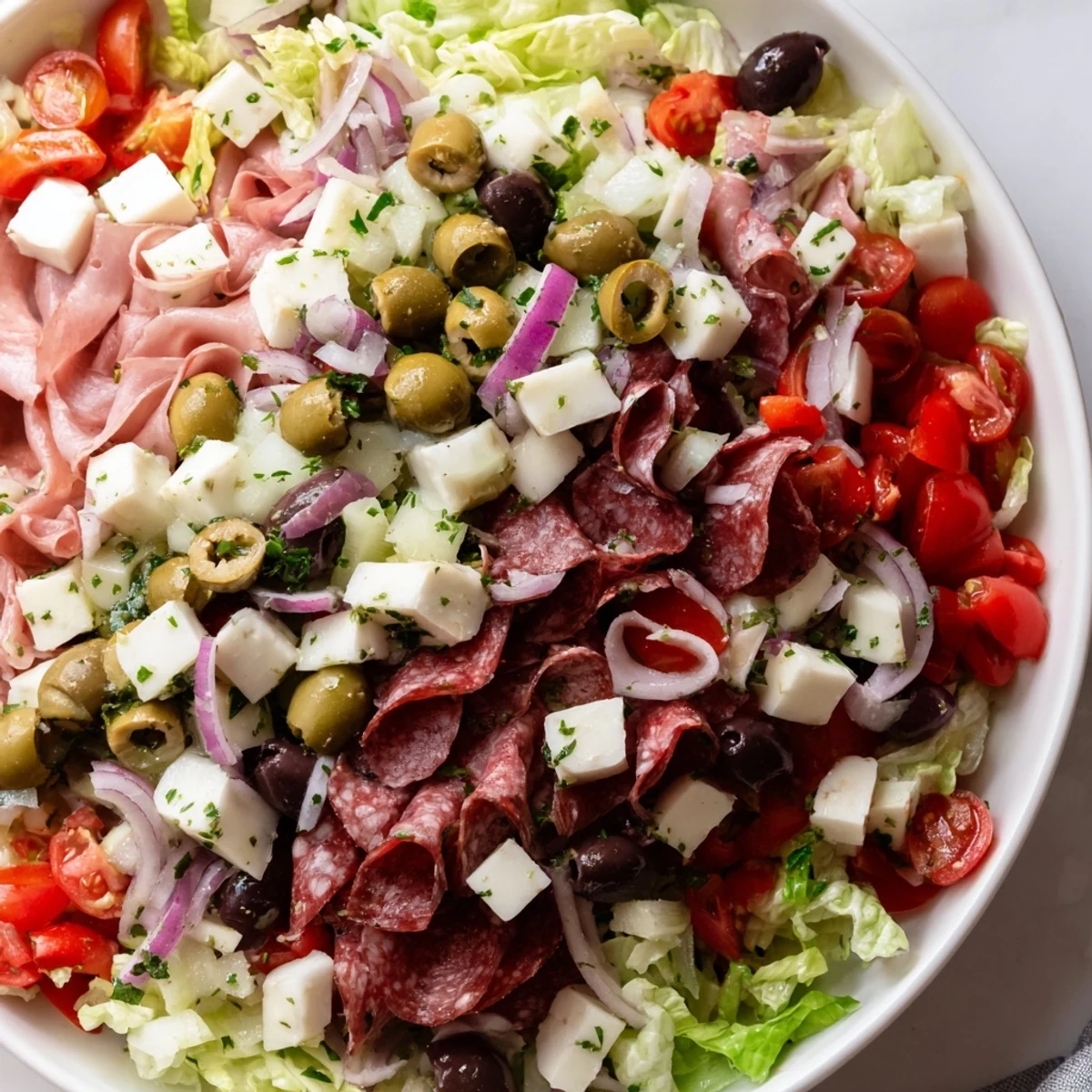 Vibrant New Orleans Muffuletta Salad with colorful vegetables and meats, perfect for a quick 20-minute dinner or lunch.