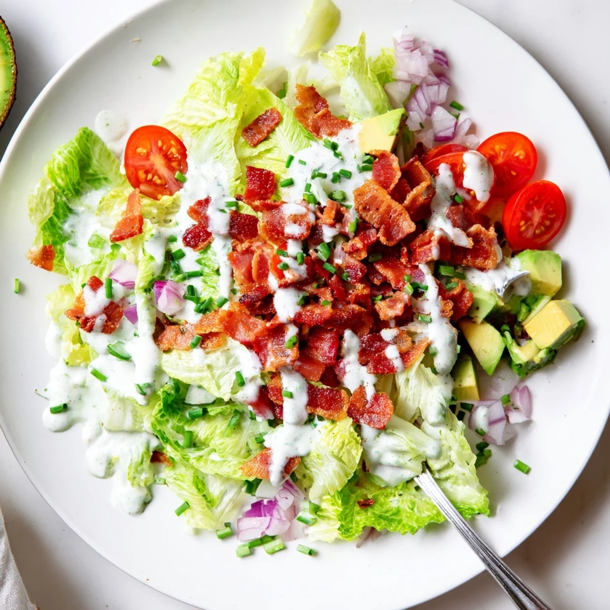 Crispy Bacon Keto BLT Salad with romaine, cherry tomatoes, and creamy dressing.
