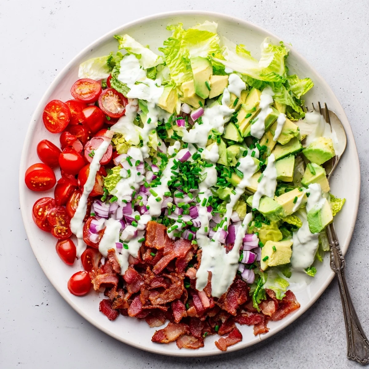 Plated Crispy Bacon Keto BLT Salad garnished with chives, ready for a low-carb lunch.