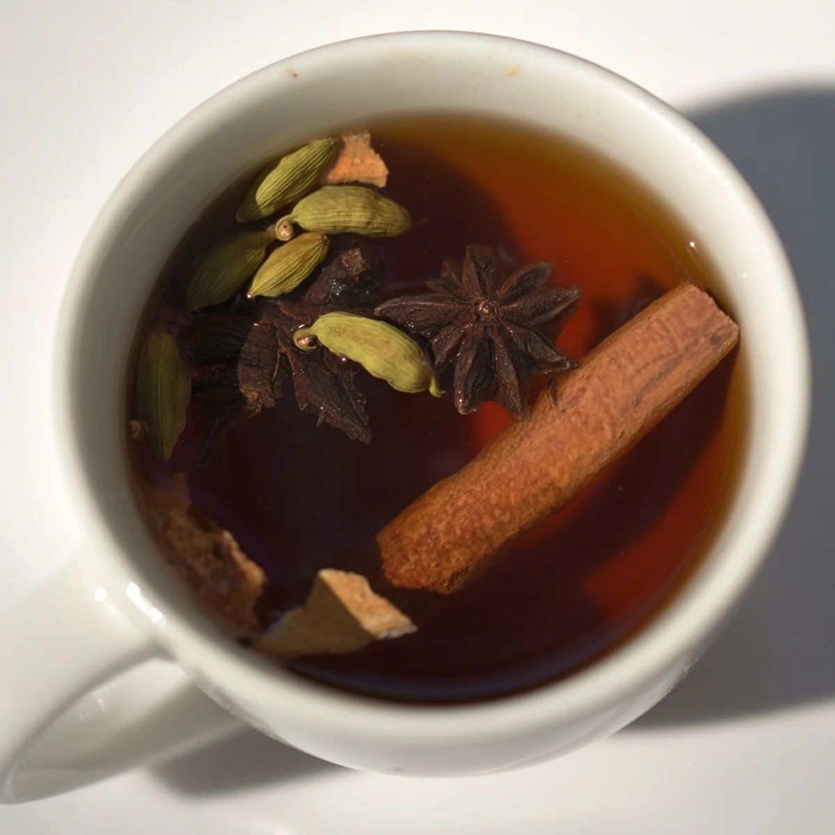 Golden black tea brewed with warming cloves and fresh ginger slices