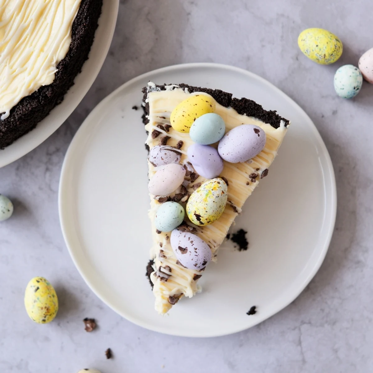 Slice of indulgent Easter Egg Cheesecake decorated with mini chocolate eggs for spring celebrations