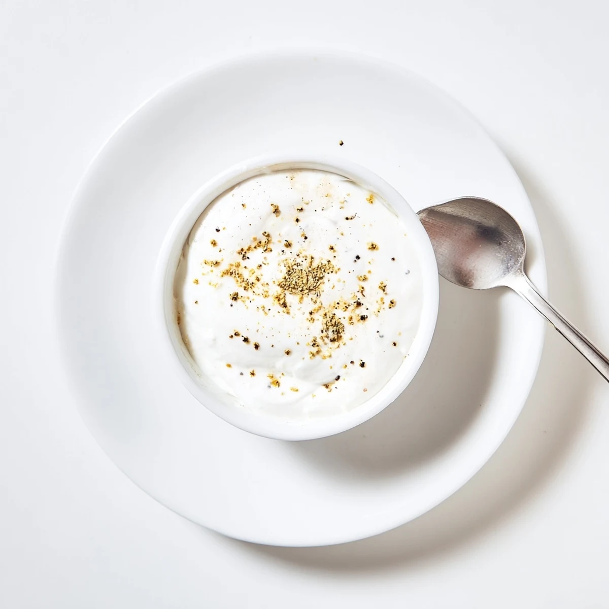 Creamy chicken shawarma garlic sauce drizzled generously over seasoned meat in a warm pita wrap