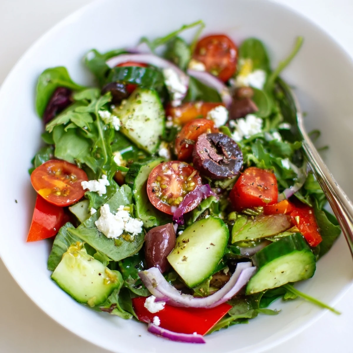 Homemade Fresh Salad Recipe tossed in olive oil, feta, bright citrus notes
