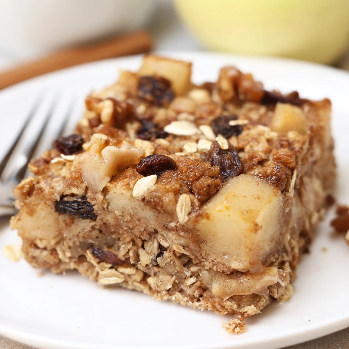 Delicious Apple Cinnamon Oatmeal Bake Recipe For Mornings, steaming in a buttered baking dish