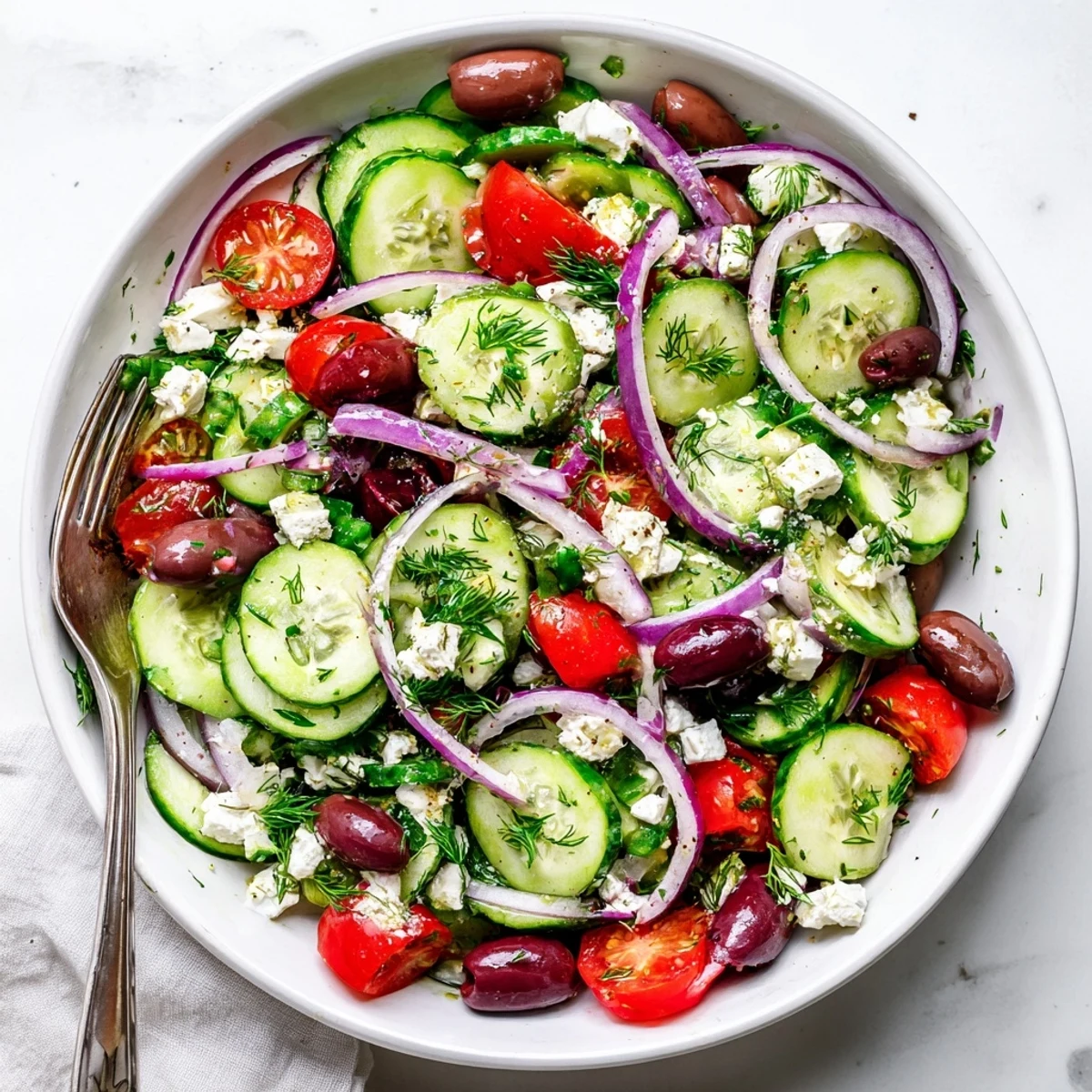 Fresh Mediterranean cucumber salad with crisp vegetables and creamy feta cheese in a bowl