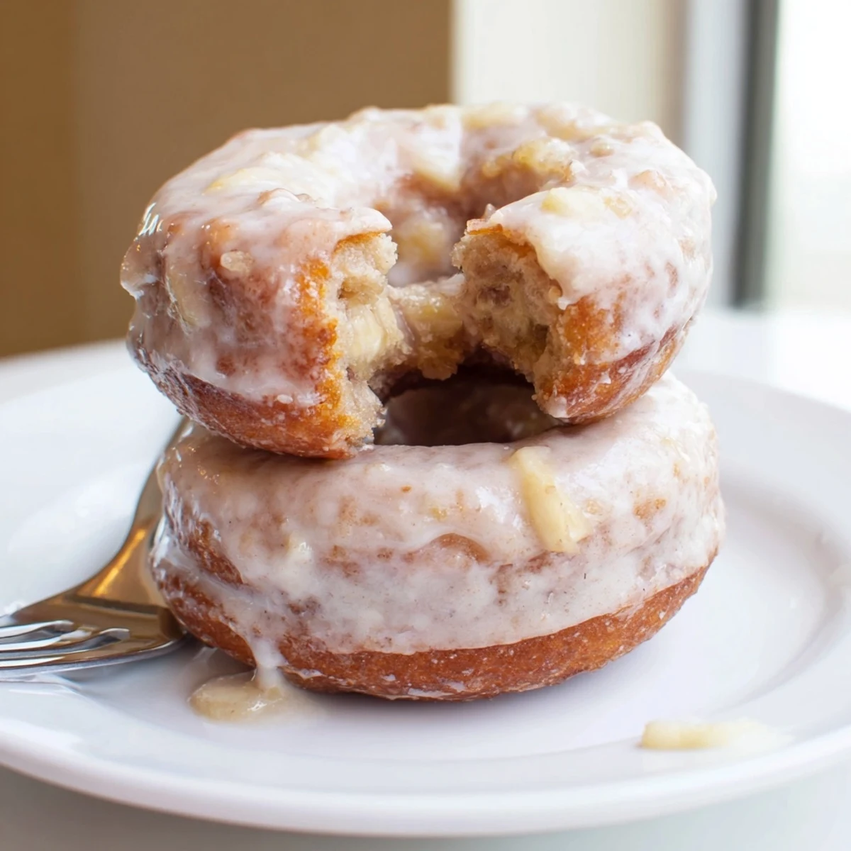 Freshly glazed Banana Donuts steaming on a rack, sweet fruity aroma  