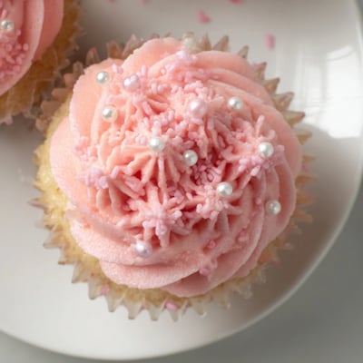 These moist Girl Baby Shower Cupcakes feature soft pink frosting and delicate sprinkles, perfect for a baby girl celebration dessert table.